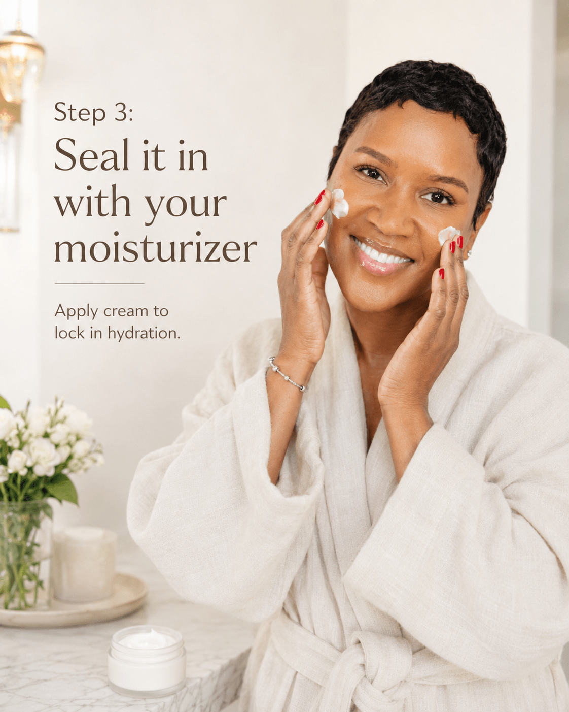 Black woman in a cream robe applying moisturizer to her cheeks with her fingertips, with text reading "Step 3: Seal it in with your moisturizer."